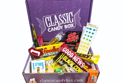 A Classic Candy subscription box filled with candy like Black Cow, Oh Henry, Goodbar, Pop Rocks and many more.