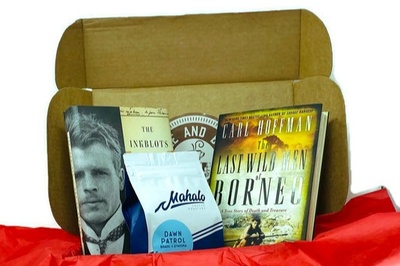 Items from a My Coffee and Book Club subscription box, including 2 books and a bag of ground coffee.