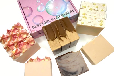 Items from a Soap Box subscription box including bars of soap shaped like desserts.