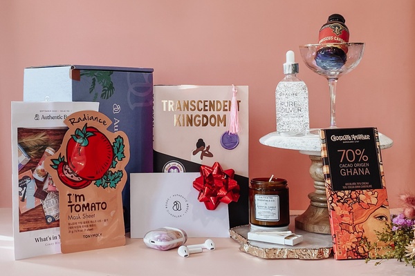  Authentic Books box display: a face mask, the book Transcendent Kingdom, chocolate from Ghana, and other beauty products