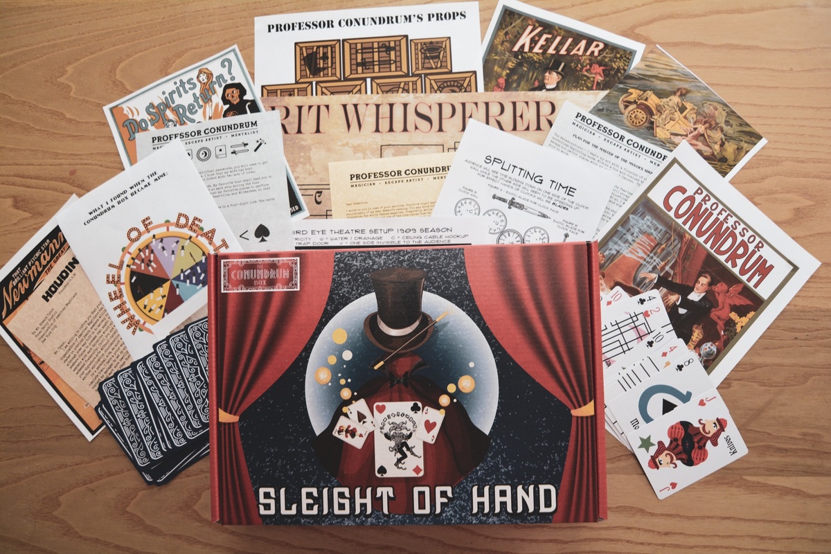 A Conundrum Box subscription box titled Sleight of Hand, surrounded by informational cards.