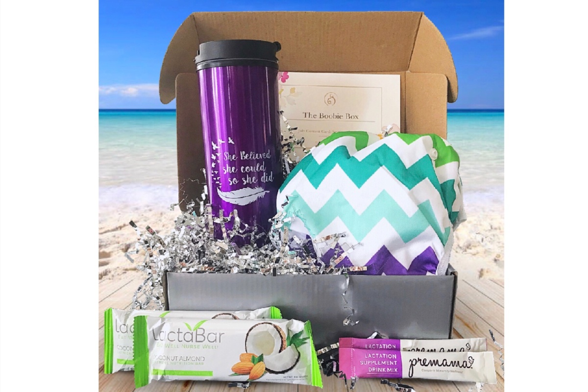 A the Boobie Box subscription box with a chevron striped nursing cover and a water bottle with an inspirational quote.