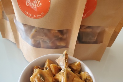 spicy almonds and pumpkin seed brittle featured in one of our mini hot stuff food boxes. Each mini box includes 3-4 spicy items.