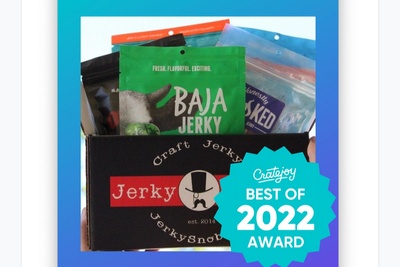 Cratejoy Best of 2022 Award logo and a one pound box of 8 flavors of a variety of jerky, flavors vary each month.