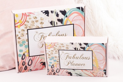 2 The Fabulous Planner subscription boxes with floral designs. One is big and one is smaller.