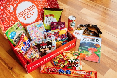 An open Japan Crate subscription box filled with Japanese candy and snacks.
