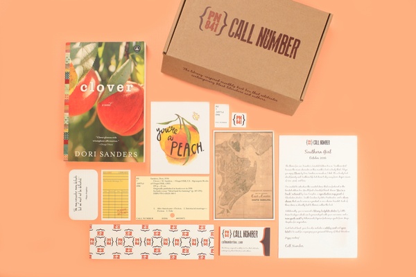 peach colored items and books from the Call Number book box