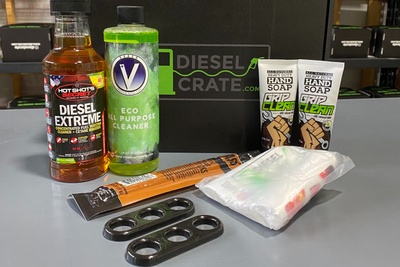 Items from a Diesel Crate subscription box, including all purpose cleaner, fuel injection cleaner, hand soap and more.