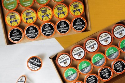 Single Cup Club subscription boxes filled with lots of single serve coffee pods.