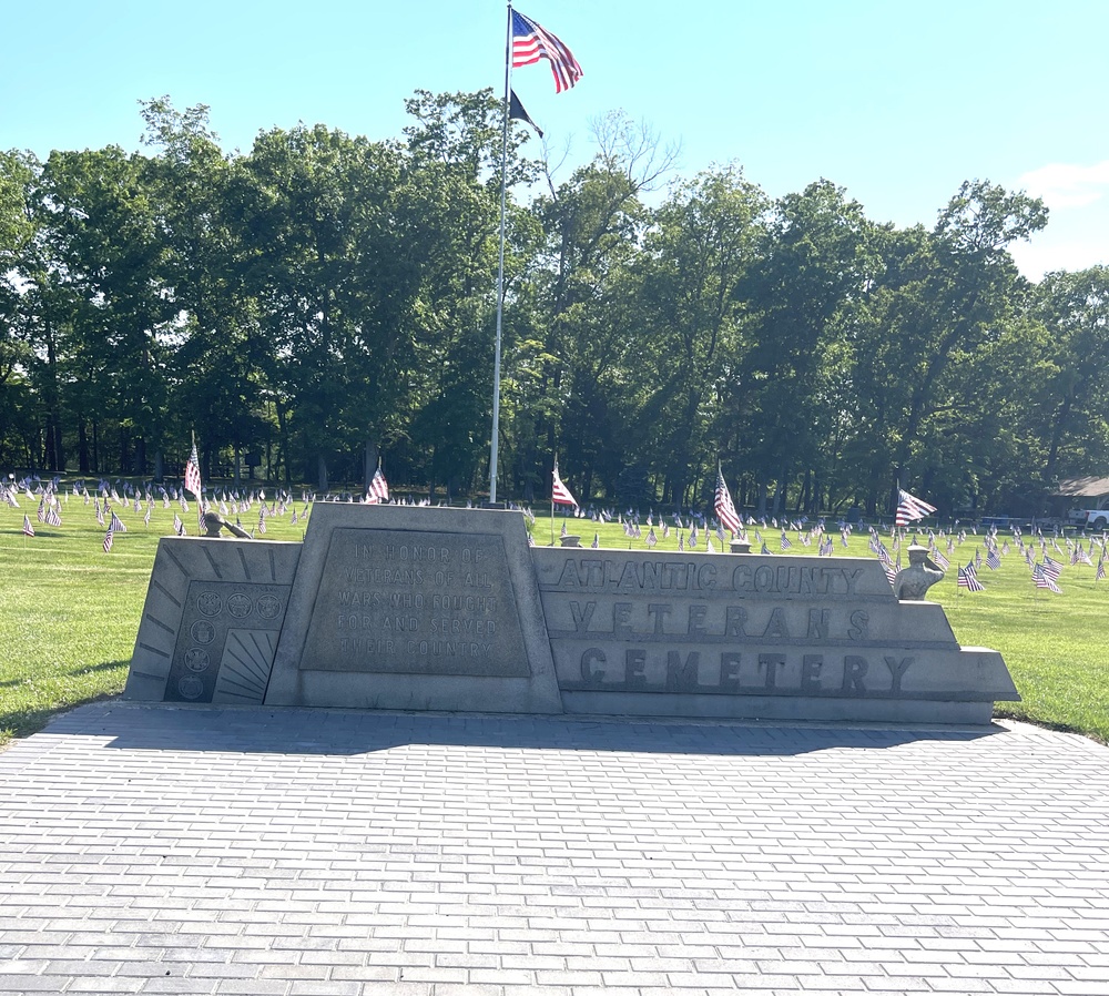 Girl Scouts and Leaders from Lenape Pines Service Unit, a part of Girl Scouts of Central and Southern New Jersey, place flags to honor Veterans.