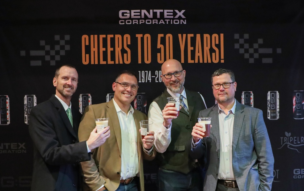 Gentex executives at the "Cheers to 50 Years" event at Tripelroot Brewery, celebrating 50 years of Gentex. 