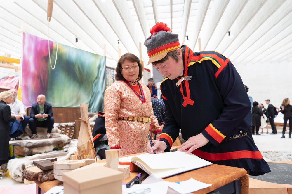 Katarina Spik Skum and Anders Sunna at the inauguration of 'Girjegumpi: The Sámi Architecture Library' by Joar Nango and collaborators at the Nordic Countries Pavilion (18th International Architecture Exhibition – La Biennale di Venezia). Photo: Federico Sutera (2023). CC BY-SA 4.0.