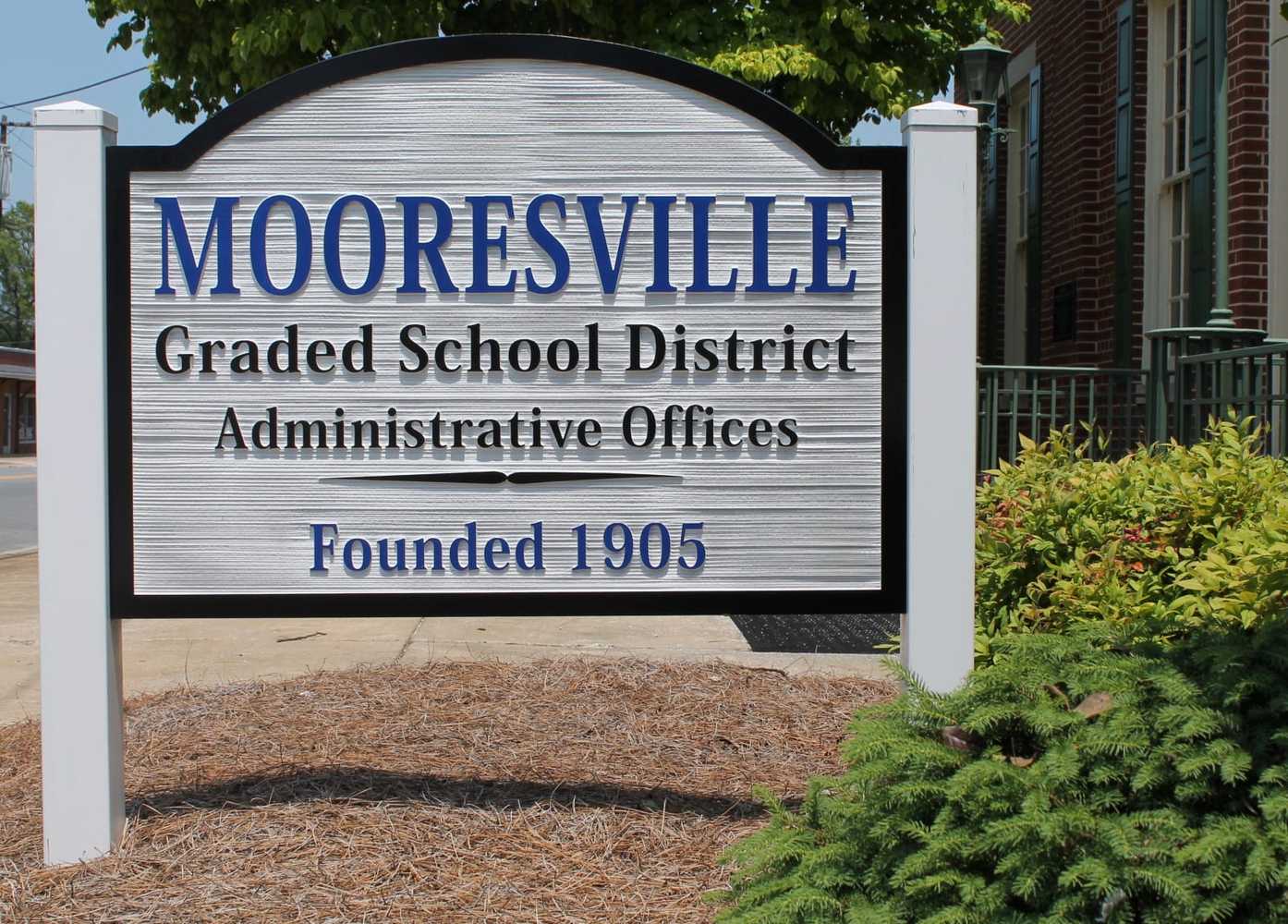 District building side view with sign.