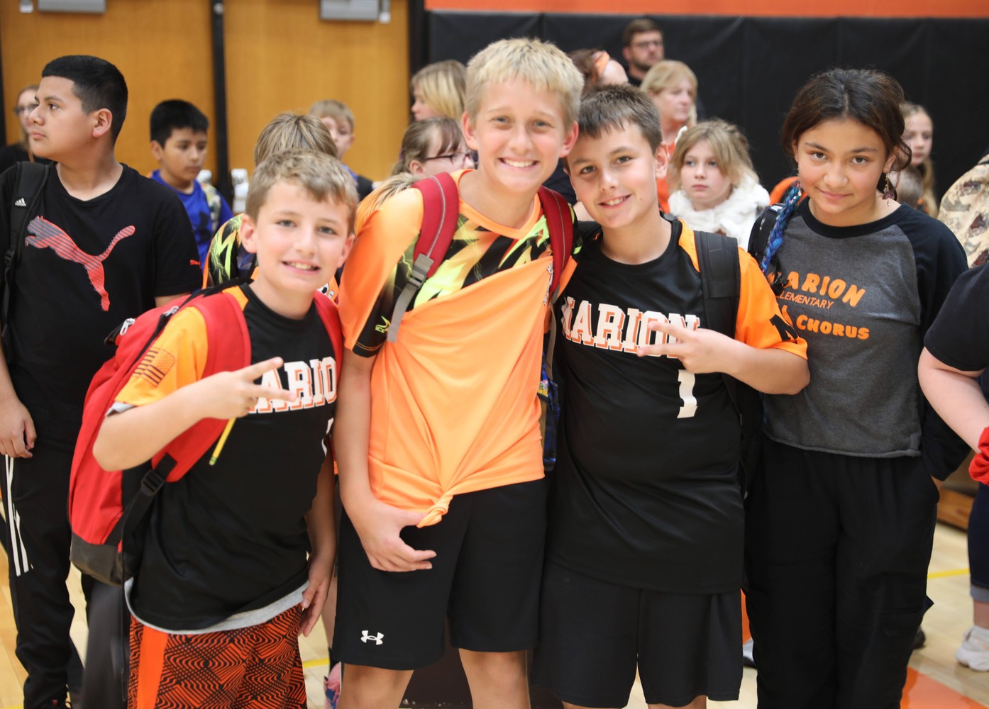 Students smile at the end of the pep rally 