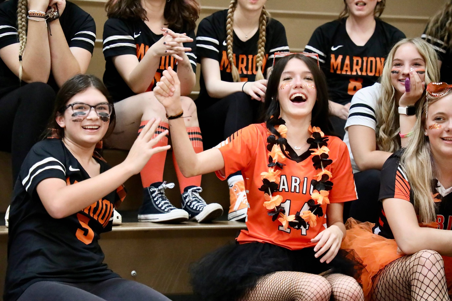 Students celebrate with the winner of the balloon stomping contest 