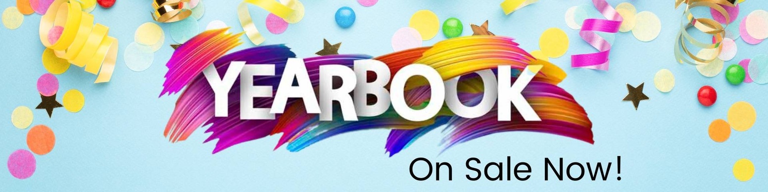 A banner promoting the sale of yearbooks. The banner features the word "YEARBOOK" in colorful, stylized letters, surrounded by confetti, streamers, and paintbrush strokes. The text "On Sale Now!" is included below the word "YEARBOOK."