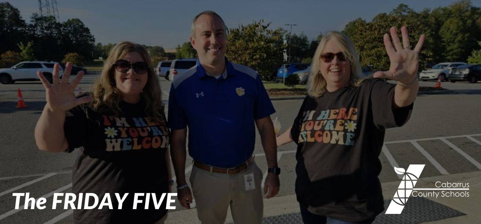 MPMS staff members holding up five fingers.