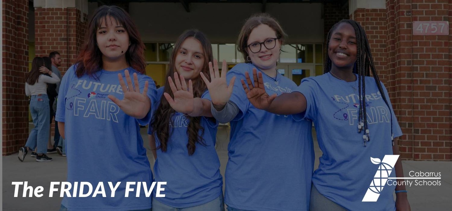 Students holding up five fingers.