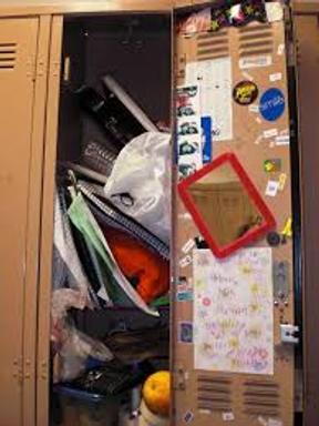 Locker overflowing with supplies and garbage