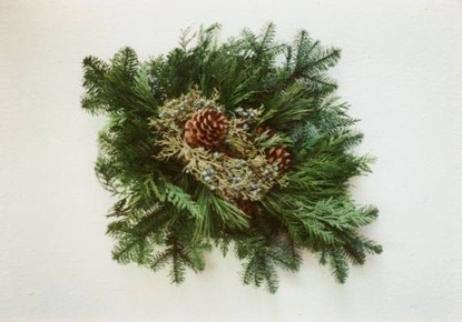 Swag of greens with pine cones in center