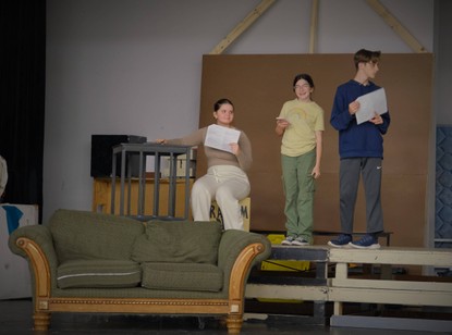 Three Students on Stage