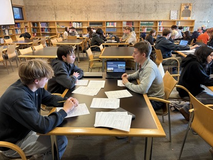 Image of students presenting their climate change presentations.