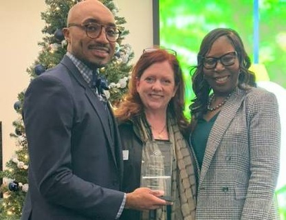 Dr. Gurley, Kate Lambert, Dr. Otey holding award