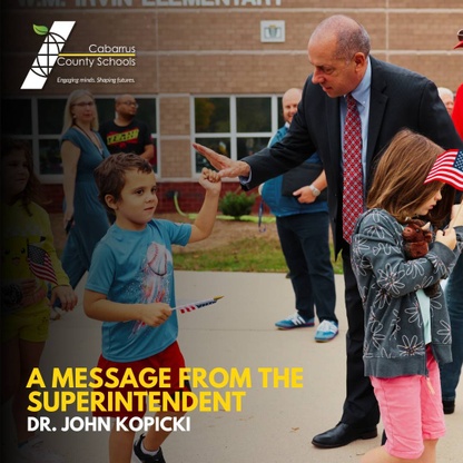 Dr. Kopicki high-fiving a student at W.M. Irvin Elementary.