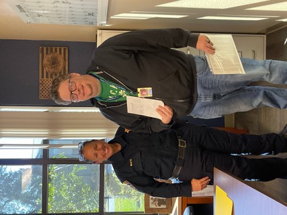 A man poses for a photo with a CHP officer