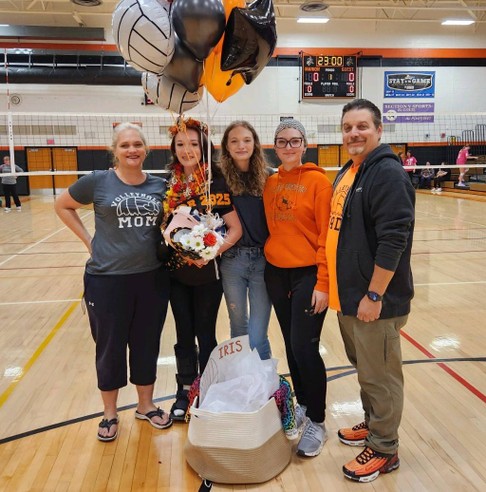 Senior volleyball player with her family