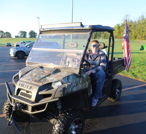 A student sits in a four-wheeler