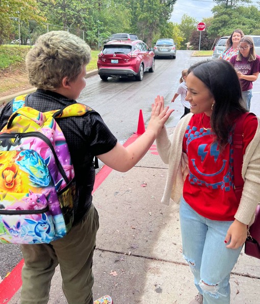 2 people give high fives