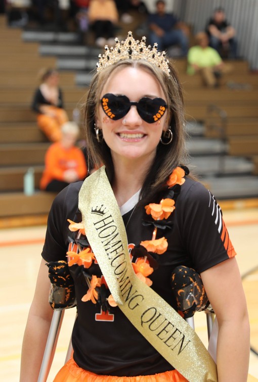 The Homecoming Queen smiles