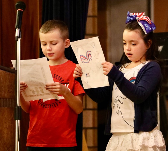 Students perform a reading 