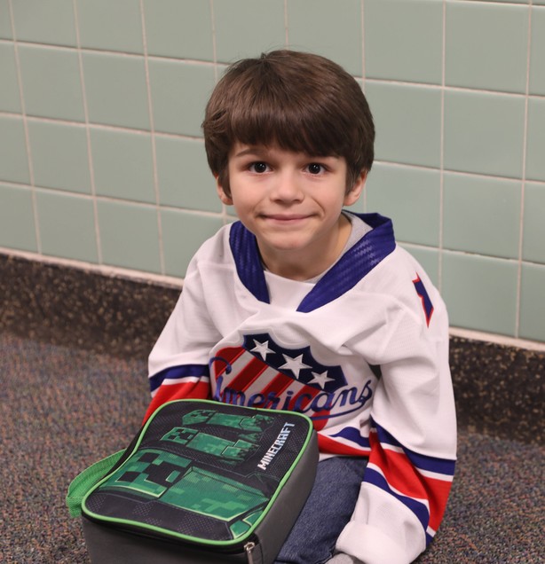 A student in a Rochester Americans jersey