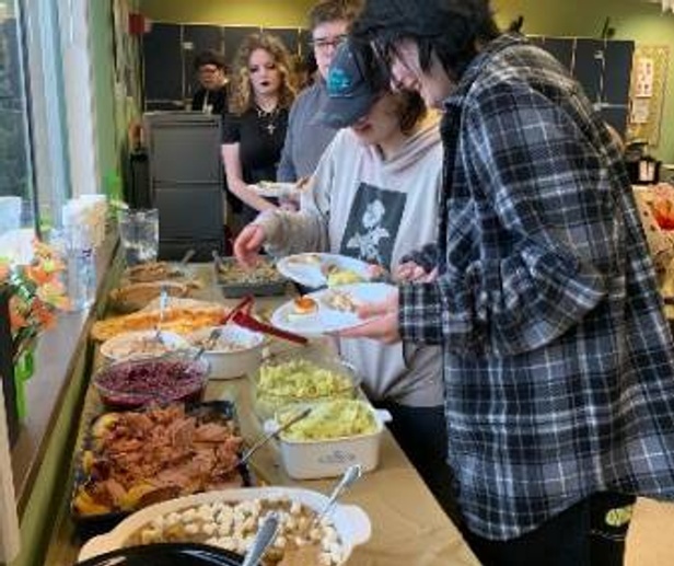 students and first responders eating together