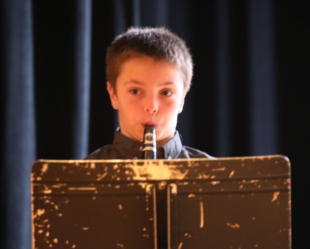 A member of the Beginner Band performs.