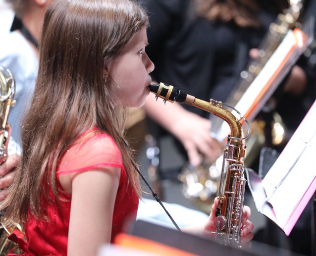 A member of the Fifth and Sixth Grade Band performs.