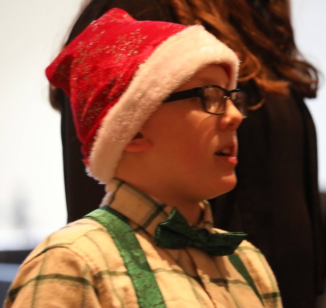 A member of the Fifth and Sixth Grade Chorus sings.