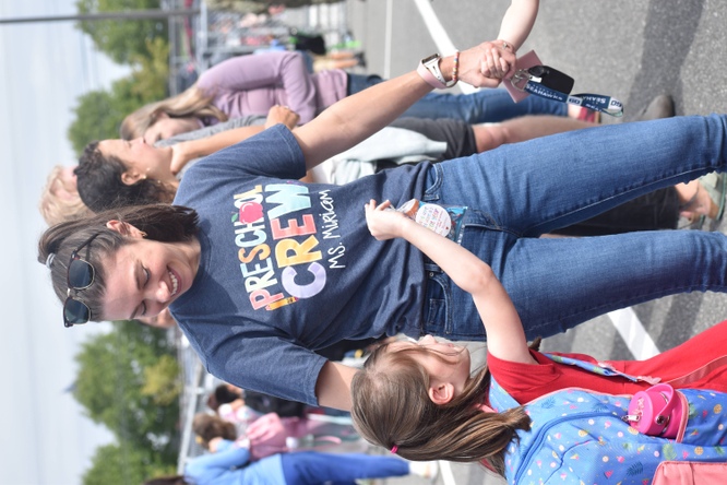 staff member greets new kinder student at hillcrest elementary