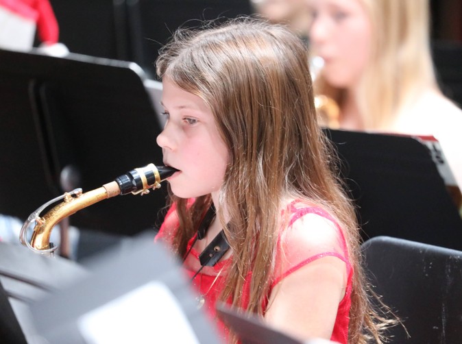 A member of the Fifth and Sixth Grade Band performs.