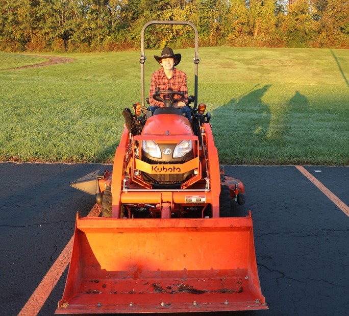 A student on a tractor 