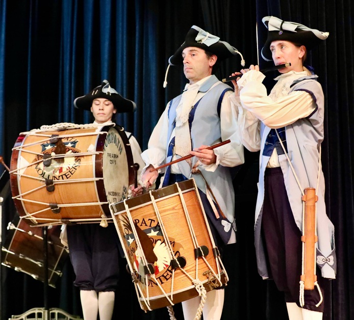 Members of the Towpath Fife and Drum Corps perform at the assembly.