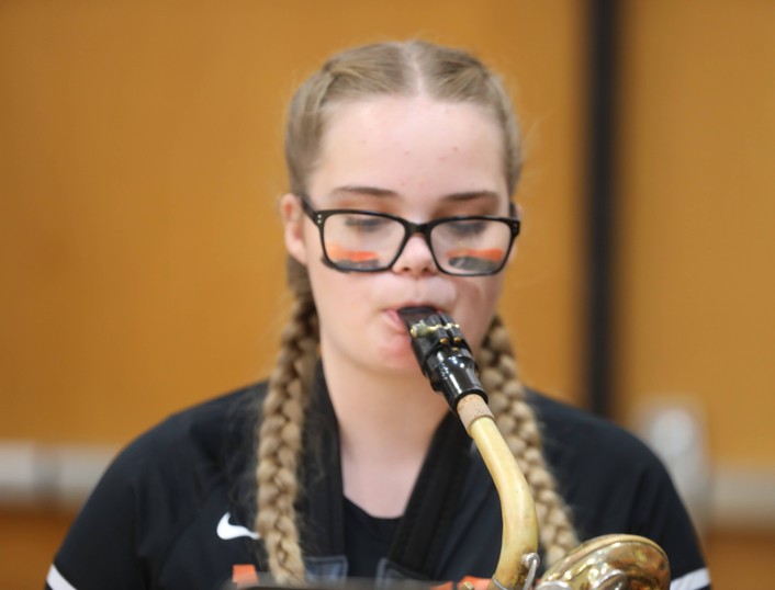 A student plays the saxophone