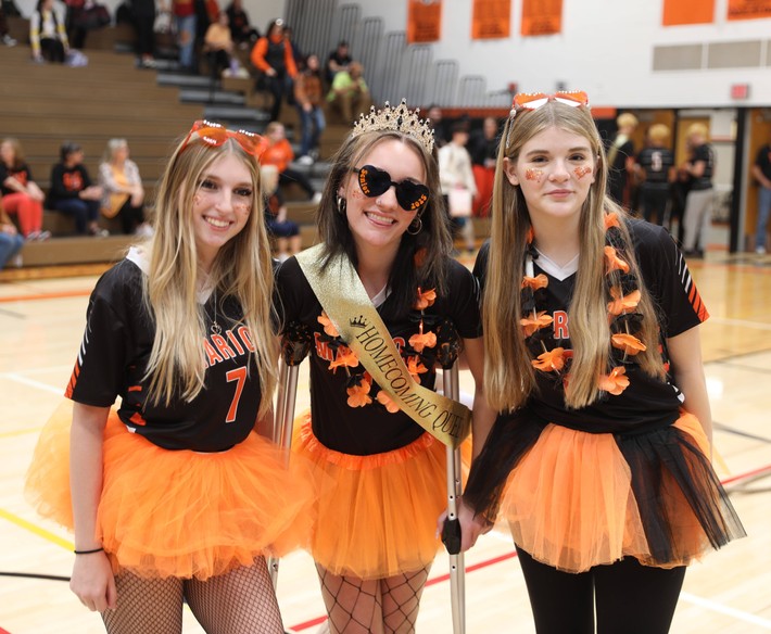 Students pose for photos with the Homecoming Queen