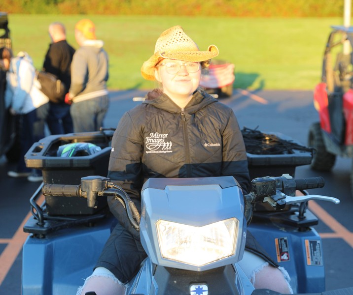 A student sits in a four-wheeler