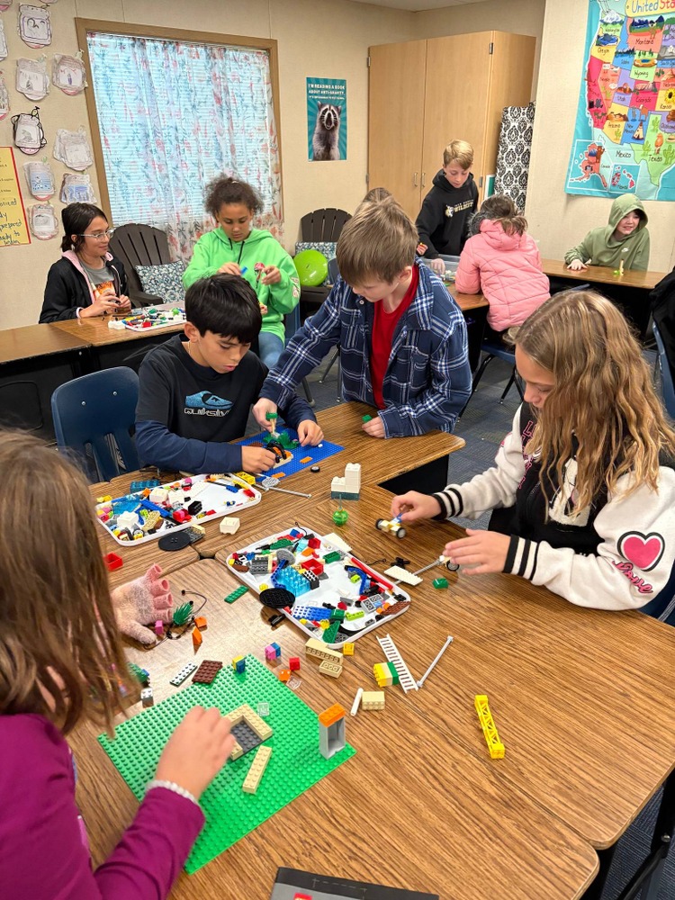 students designing dwellings with legos