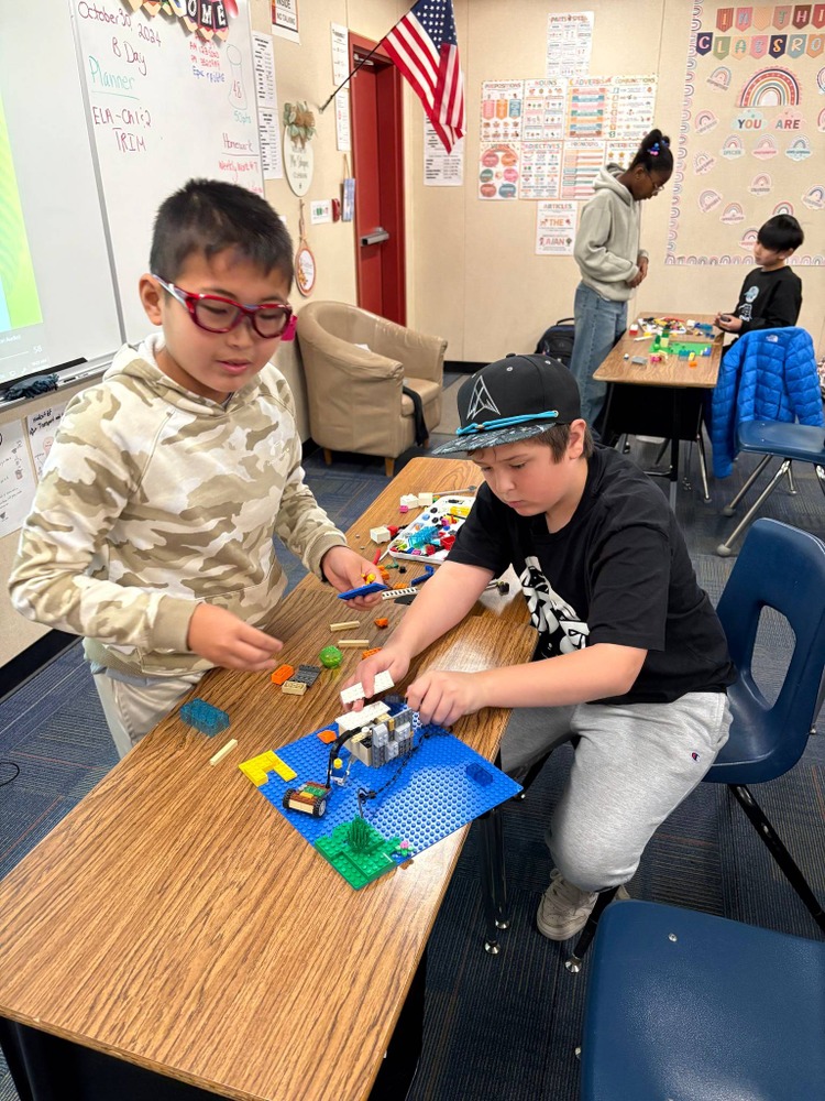 students building with legos