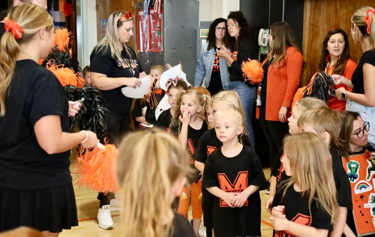 Students enter the pep assembly