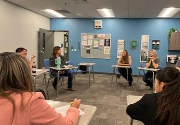 Trustee Kyrsti Bruce addresses a group of volunteers